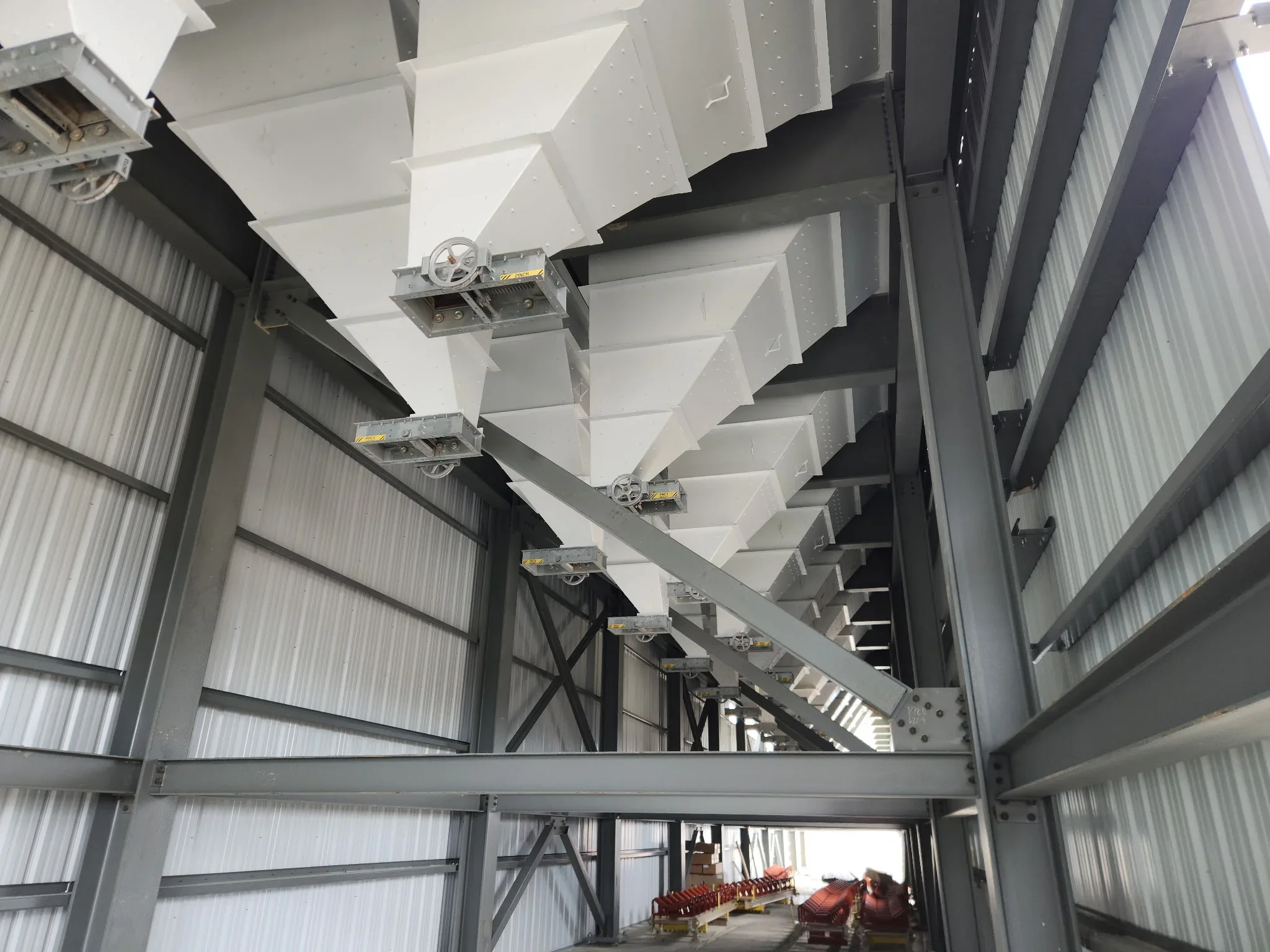 Industrial steel structure with corrugated walls and overhead beams after sandblasting preparation